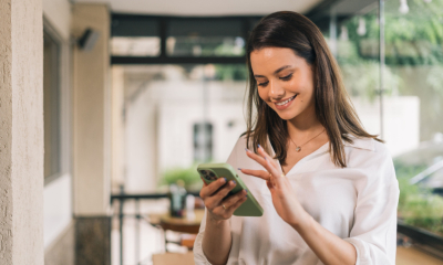 A young woman uses the HMRC app