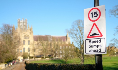 Traffic sign indicating speed bumps and speed limits