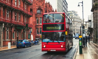 Red double-decker bus at the street of Birmingham, UK