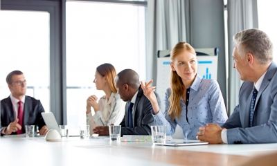Build your company's board Directors talking around boardroom table