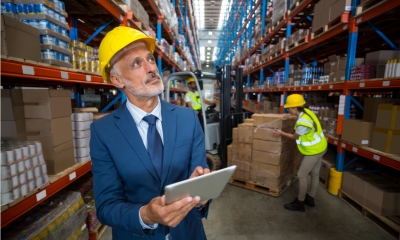 Business owner doing stock audit in a warehoouse
