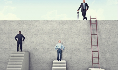 Three businessmen attempting to climb the wall