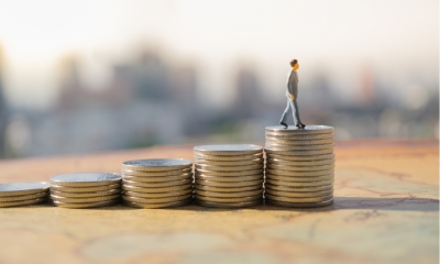 Coins stacks representing tax revenue rise