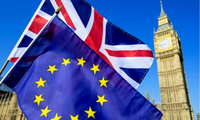European Union flag and Union Jack flag next to Big Ben
