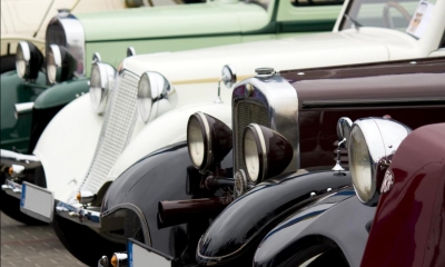 Row of multiple classic cars lined up