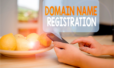 A business woman registers a domain name for her business