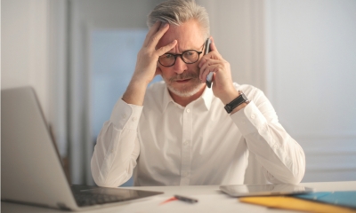 A worried man talking on the phone