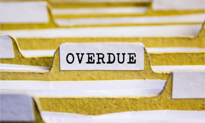 Hanging files filled with overdue invoices