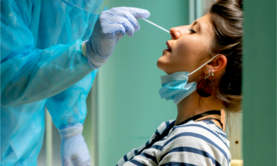 A woman has a COVID test