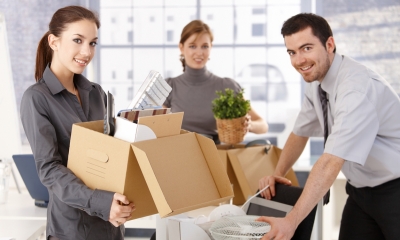 Moving premises - checklist Staff packing moving boxes ready to relocate the business