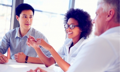 Three business professionals working together Three business professionals working together
