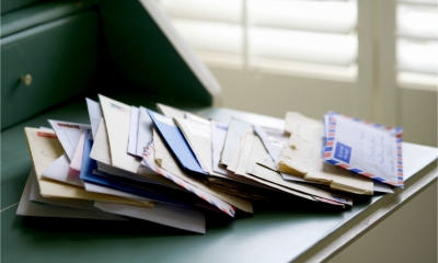Pile of mail on a desk