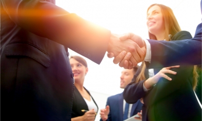 Group of businesspeople – shake hands agreeing to collaborate