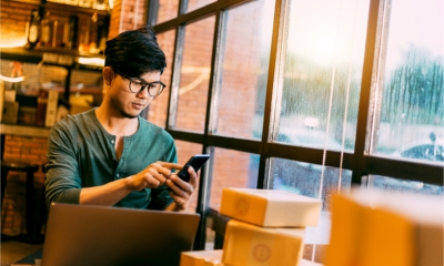 Entrepreneur checks and dispatches the orders he received via his ecommerce site