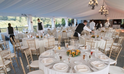 Tables set at an outdoor wedding after party
