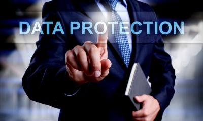 A man clicking on a data protection graphic