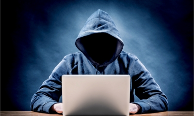 A faceless hacker maliciously takes over a legitimate business domain name.