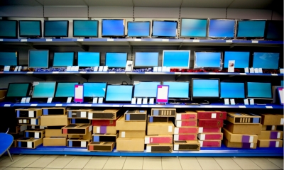 A shop displaying rows of laptops and computer monitors