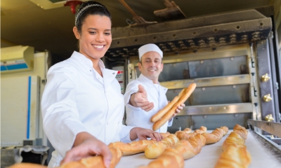 An apprentice working in a bakery