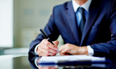A businessman signing a contract