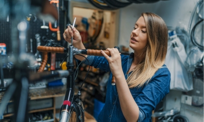 bicycle mechanic is repairing a bike in the workshop