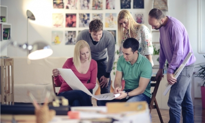 A group of employees discussing a project