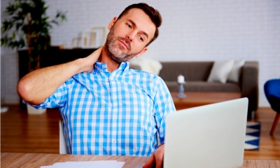 Mature entrepreneur suffering from neck pain Mature entrepreneur suffering from neck pain