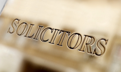 Suing Signplate on building saying Solicitors