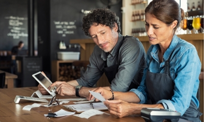 Business owners analysing their business' performance