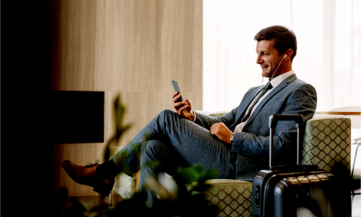 Businessman makes a call from the business lounge of an airport