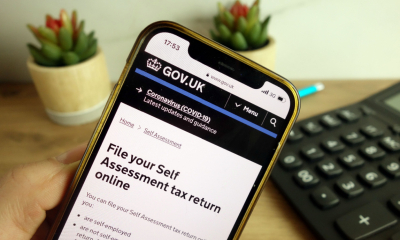 A person logs into the HMRC app to check whether a message is fraudulent