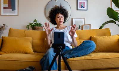 A woman earns money on the side by vlogging