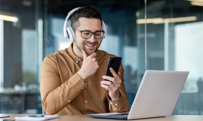 A man listening to the Start Your Own Business podcast
