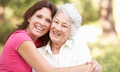 Lasting power of attorney Young woman smiling and hugging an older woman