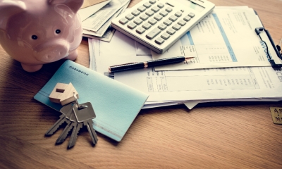 A pile of documents evidencing an entrepreneur's ability to pay a mortgage after previous financial problems