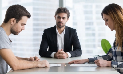 A couple sign their no-fault divorce papers