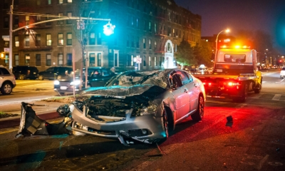 A recovery vehicle removes a car after a road traffic accident